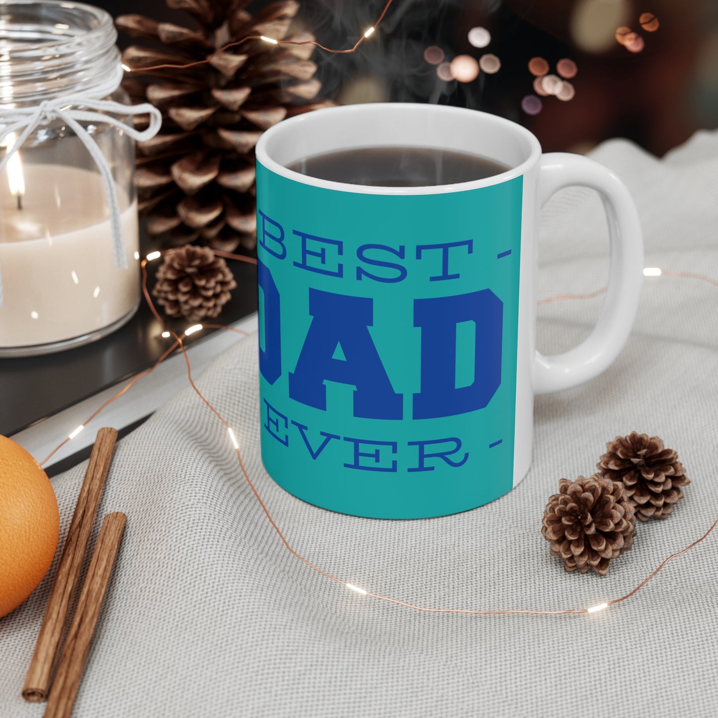 “BEST DAD EVER” on one side and a dad cooking happily with his kid. Part of several mugs to choose from depending on what resonates with you.