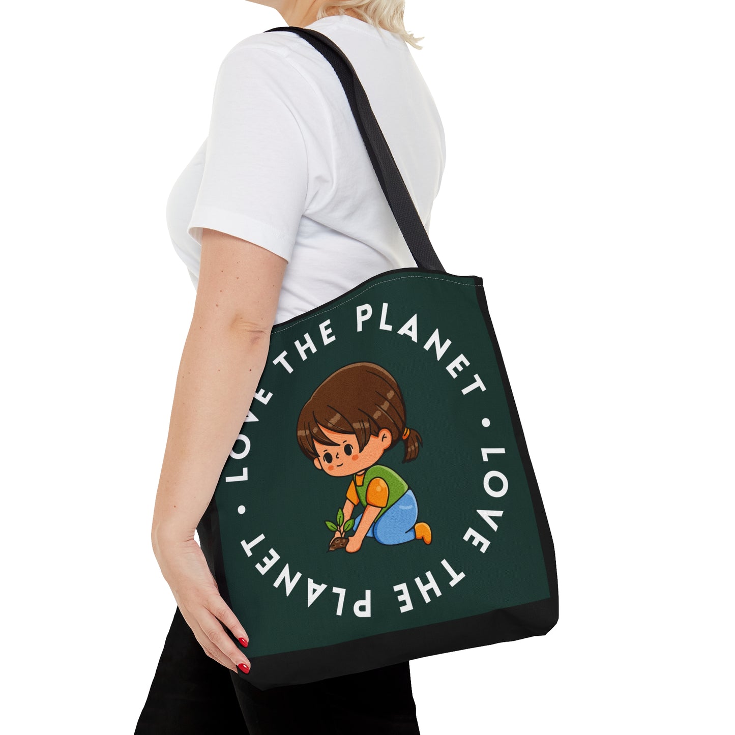 Caring kid planting a tree inside a  “LOVE THE PLANET” Tote Bag in 3 sizes to meet your needs. Available in black.