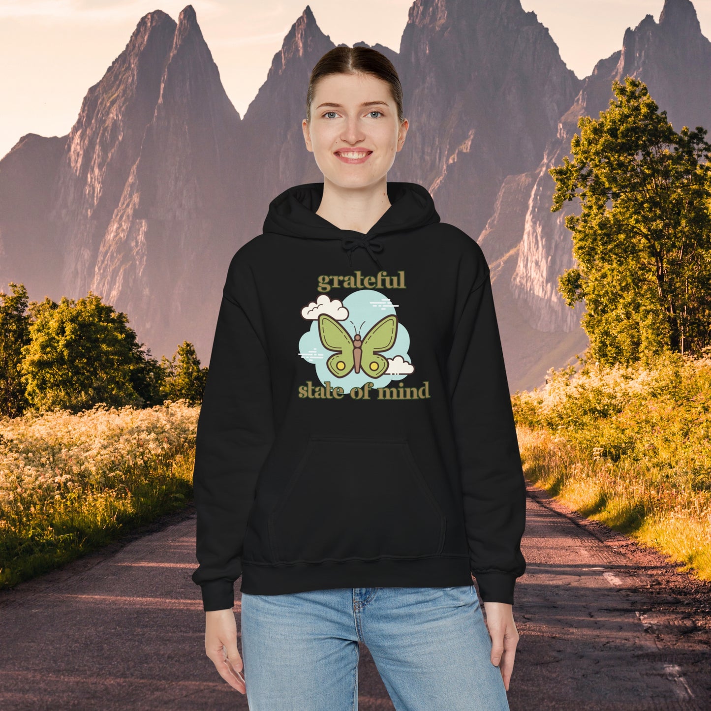 Grateful state of mind around a simple butterfly design on this Unisex Heavy Blend™ Hooded Sweatshirt